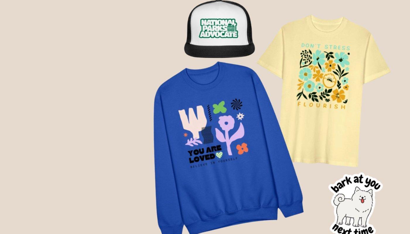 custom sweatshirt, t-shirt, trucker cap and sticker print on demand product examples